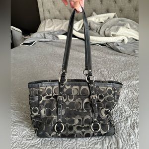 Coach handbag/ purse with shoulder straps. Good condition. Black and grey logo.